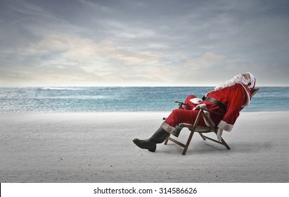 Santa Claus Sleeping At The Beach