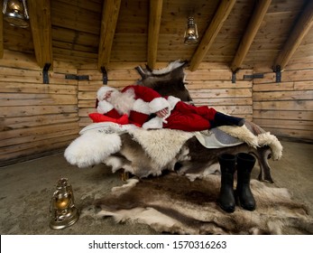 Santa Claus sleeping in his log cabin - Powered by Shutterstock