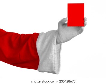 Santa Claus Theme: Santa's Hand Holding A Blank Red Card On A White Background