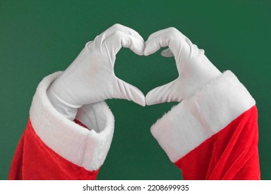 Santa Claus Two Hands Making Heart Shape Gesture Isolated On Green Background. Close Up. Sign of Love, Approval. Christmas Congratulation. Like. Chroma Key Screen. White Gloved Hands Forms a Heart. - Powered by Shutterstock