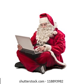 Santa Claus Using A Laptop Computer