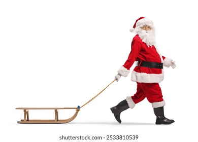 Santa Claus walking with a wooden sled and looking at camera isolated on white background  - Powered by Shutterstock