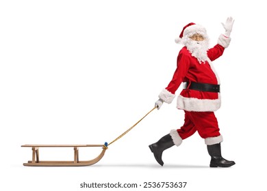 Santa Claus waving and pulling a wooden sled isolated on white background   - Powered by Shutterstock