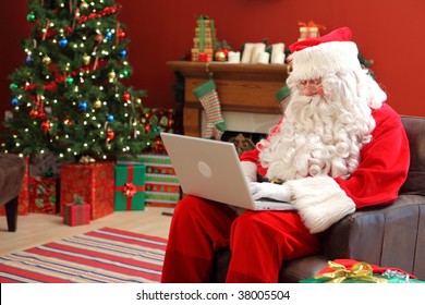 Santa Claus Working On Laptop Computer