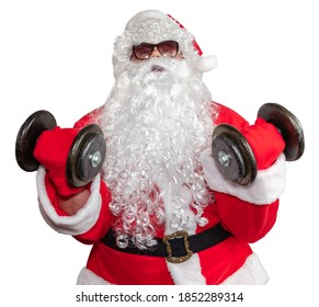 Santa Claus Working Out With Two Dumbbells And Doing Bicep Curls. Santa Is Pushing It Really Hard. Santa Wearing Sunglasses And A Long White Beard. Isolated On White Background.