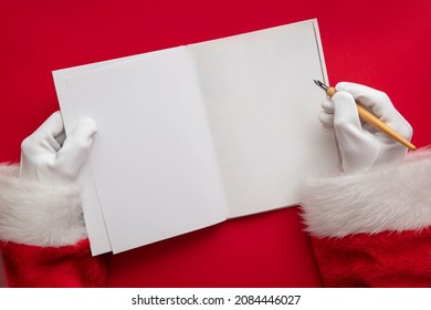 Santa Claus writing a naughty or nice list in a book. blank page mock up - Powered by Shutterstock