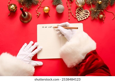 Santa Claus writing to-do list with Christmas decor on red background - Powered by Shutterstock