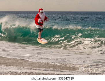 Santa Clause Catching A Wave On A Beautiful Beach. Santa Hang Ten. Santa Surfing.