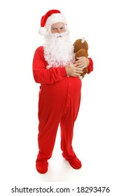 Santa Clause In Footy Pajamas With His Teddy Bear.  Full Body Isolated On White.