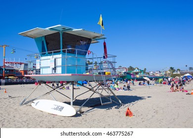 SANTA CRUZ, CALIFORNIA - AUGUST 2, 2016: An active lifeguard tower on a busy summer day at Main Beach on August 2, 2016 in Santa Cruz, California.