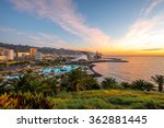 Santa Cruz cityscape view with park, ocean and mountains on the background on the sunrise, Canary islands, Spain  