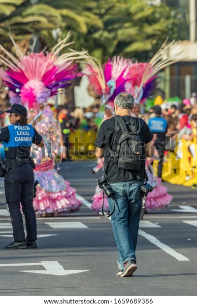 SANTA CRUZ DE TENERIFE, SPAIN - FEBRUARY 25,\
2020: Coso parade - along the Avenida de Anaga, official end of\
Carnival. Again march carnival groups, floats, decorated cars and\
the Carnival Queens.
