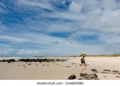 SANTA CRUZ ISLAND, GALAPAGOS ISLANDS, ECUADOR - MARCH 12, 2022: People Visit Tortuga Bay, A Beach That Is Home To A Wide Range Of Galapagos Islands Wildlife Species. 