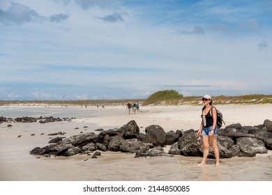 SANTA CRUZ ISLAND, GALAPAGOS ISLANDS, ECUADOR - MARCH 12, 2022: People Visit Tortuga Bay, A Beach That Is Home To A Wide Range Of Galapagos Islands Wildlife Species. 