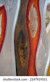 Santa Fe, New Mexico, U.S.A.-April 17,2022; Faces In Colorful Orange White And Yellow Glass Of Art Installation By Raya Friday At Santa Fe Botanical Gardens Vertical Format Room For Type