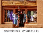 Santa Fe Southwestern adobe shop with clothing hanging outside