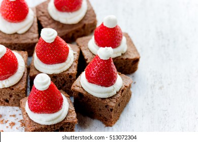 Santa Hat Brownie Bites With Strawberries And Whipped Cream Or Cheese Frosting - Creative Christmas Dessert Idea For Festive Party