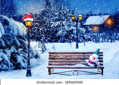 Santa hat and New Year's soft toy on a bench in the winter forest against the background of a village house and lantern. Christmas art card. Winter wonderland.