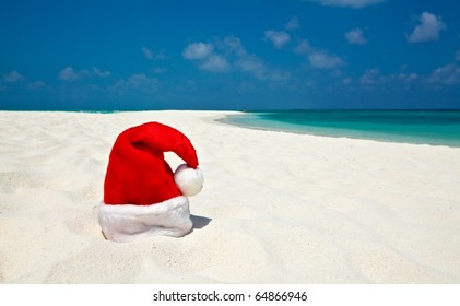 Santa Hat Is On Infinity Coral Sandy Beach