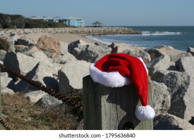 Santa Hat Perched On The Fence Along The Trail At The Fort Fisher Recreation Area In Wilmington, NC.