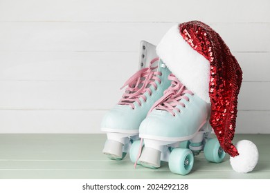 Santa hat with rolling skates on table