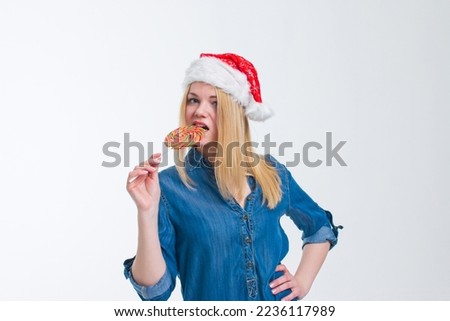 santa hat woman holding a lollipop in white screen