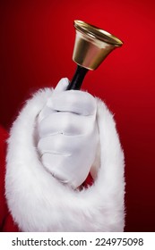 Santa Holding Hand Bell Closeup