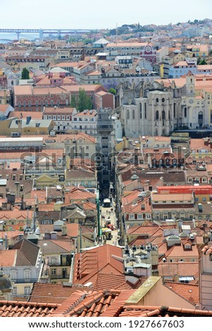 Santa Justa Elevator (Elevador de Santa Justa) and Igreja do Carmo at histoical Baixa district, Lisbon, Portugal. Santa Justa Elevator was built by Raoul Mesnier du Ponsard with Neo-Gothic style. 