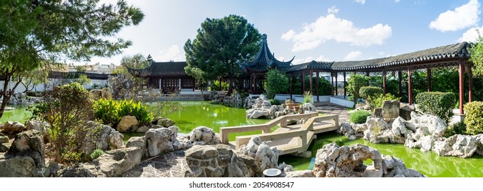 Santa Lucija, Malta - November 4th 2018: A Path Going Over A Small Bridge Crossing A Pond At The Chinese Garden Of Serenity, The Public Park Was A Gift From China And Opened In 1997.