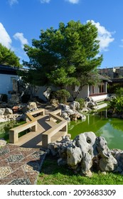 Santa Lucija, Malta - November 4th 2018: A Path Going Over A Small Bridge Crossing A Pond At The Chinese Garden Of Serenity, The Public Park Was A Gift From China And Opened In 1997.