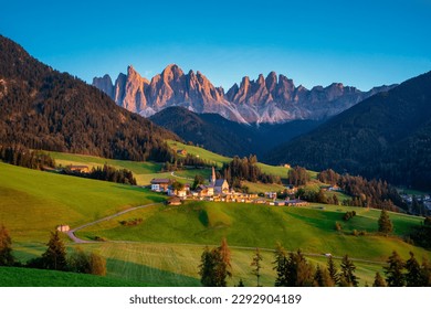 Santa Maddalena (Santa Magdalena) village with magical Dolomites mountains in background, Val di Funes valley, Trentino Alto Adige region, South Tyrol, Italy, Europe. Santa Maddalena Village, Italy. 