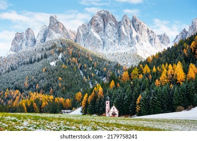 Santa Maddalena Village Church at the autumn Dolomite Alps. Amazing landscape with small chapel on snowy meadow at Santa Magdalena commune. Dolomites, South Tyrol, Bolzano, Italy