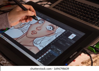 Santa Maria Capua Vetere, April 07th 2020, Italy, An artist's hand drawing a manga on her digital tablet from home