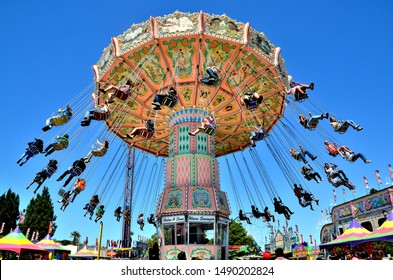 Santa Maria, CA/USA-July 15, 2015: Riders Enjoy The Wave Swinger Carnival Ride At The Santa Barbara County Fair.