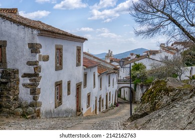 Santa Maria de Marvao, Portugal - 30 March, 2022: cobblestone street and historic whitewashed houses in the old city center of Marvao