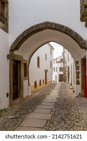 Santa Maria de Marvao, Portugal - 30 March, 2022: old city gate and cobblestone street leading into the walled old city center of Marvao