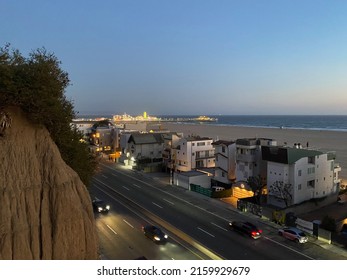 Santa Monica, CA - April 15 2022: Traffic Flowing On The Pacific Coast Highway Along Santa Monica Beach At Night