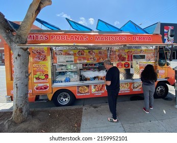 Santa Monica, CA - April 16 2022: People Ordering Streetfood On A Mexican Taco Truck