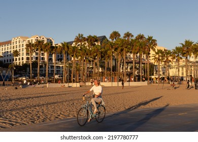 Santa Monica, CA - August 15 2022:  Young Asian Woman Riding Her Bike On The Boardwalk In Santa Monica 