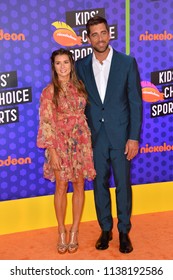 SANTA MONICA, CA. July 19, 2018: Danica Patrick & Aaron Rodgers At The Nickelodeon Kids' Choice Sports Awards 2018 At Barker Hangar