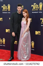 SANTA MONICA, CA - June 16, 2018: Madelaine Petsch & Travis Mills At The 2018 MTV Movie & TV Awards At The Barker Hanger, Santa Monica Airport