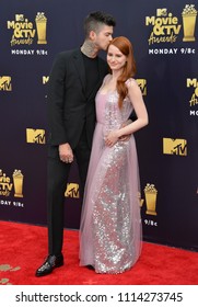 SANTA MONICA, CA - June 16, 2018: Madelaine Petsch & Travis Mills At The 2018 MTV Movie & TV Awards At The Barker Hanger, Santa Monica Airport