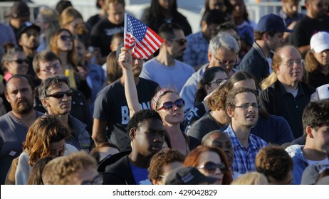 SANTA MONICA, CA - MAY 23, 2016: Female with US Flag is supporter of Bernie Sanders (D - VT) at a Presidential rally at Santa Monica High School Football Field in Santa Monica, California.