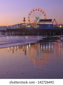 Santa Monica old Ferris Wheel and pier shown at dusk in Santa Monica, California, United States. - Shutterstock ID 142726492
