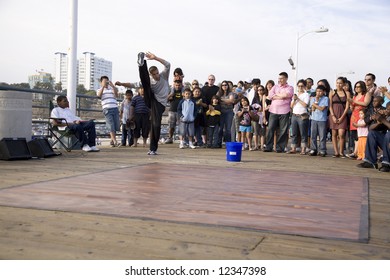 Santa Monica Pier, Santa Monica, CA May 3rd, 2008:  B-Boy Street Performer Breakdancing For The Crowd.