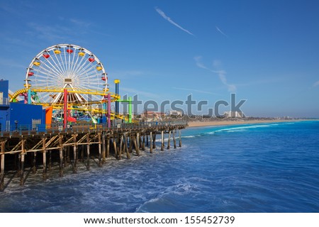 Santa Monica pier Ferris Wheel in California USA on blue Pacific Ocean