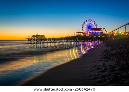 The Santa Monica Pier at sunset, in Santa Monica, California.