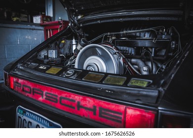 Santa Monica, Year 2018: 
Engine Of A Classic Porsche 911 In A Garage Repair.