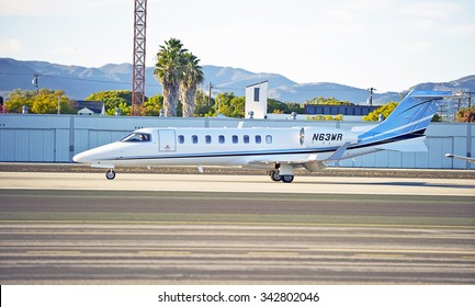 SANTA MONICA/CALIFORNIA - NOV. 22, 2015: Learjet-45 fixed wing multi engine (turbo fan) aircraft touches down on runway as it arrives at Santa Monica Airport in Santa Monica, California USA