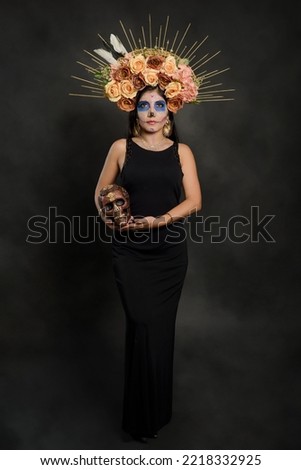 Santa Muerte. Portrait of a woman with sugar skull makeup. Halloween make-up. Portrait of Calavera Catrina